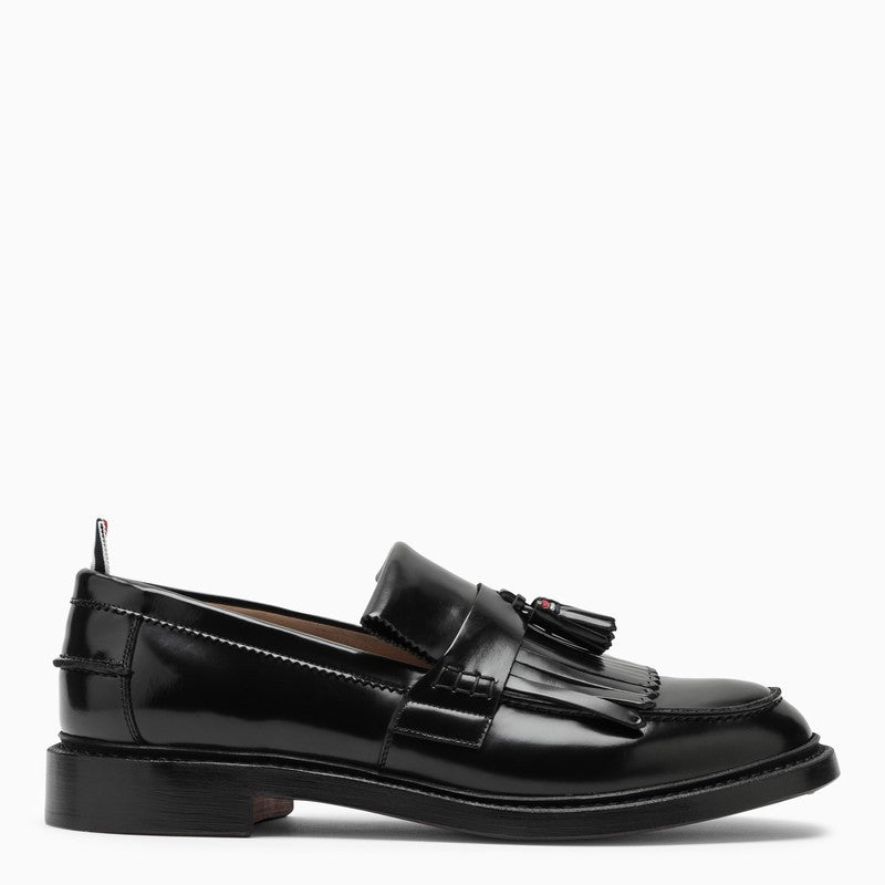 Black leather moccasin with tassels