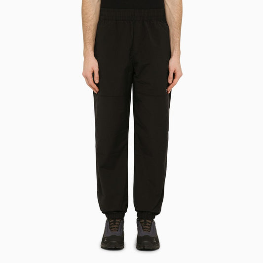 Black trousers in technical fabric with logo