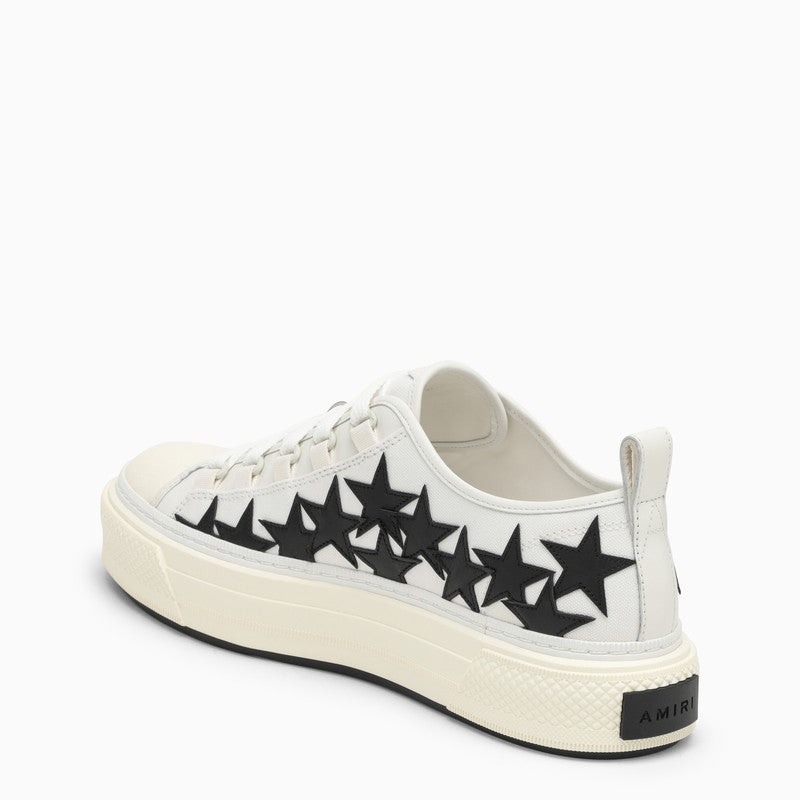 Low white trainer with stars
