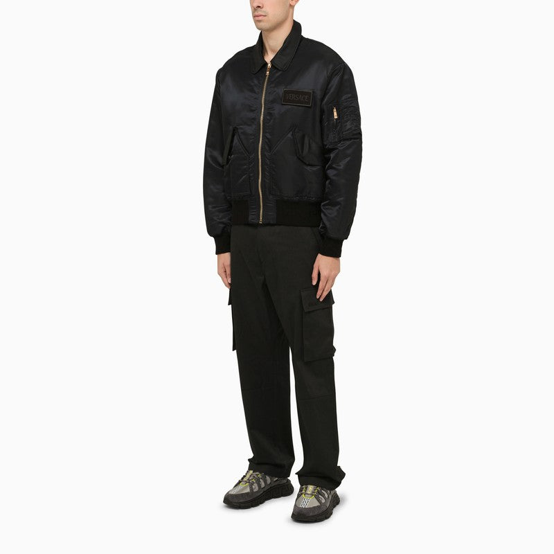 Black bomber jacket with logo applique