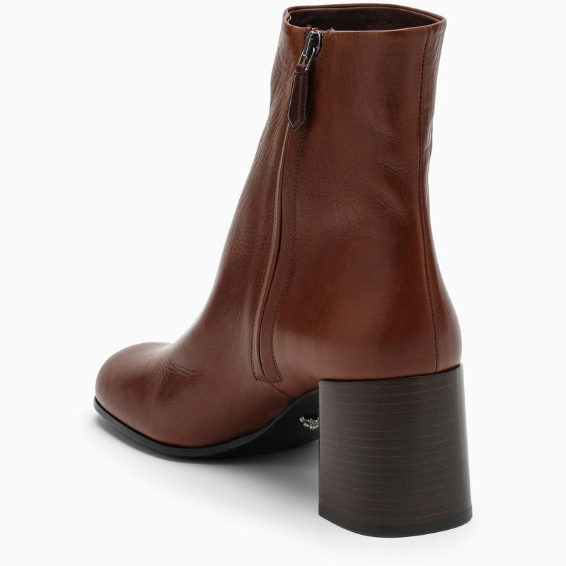 Brown leather ankle boots with logo triangle