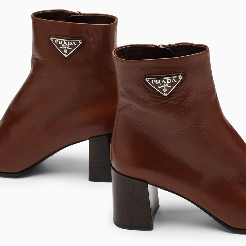 Brown leather ankle boots with logo triangle