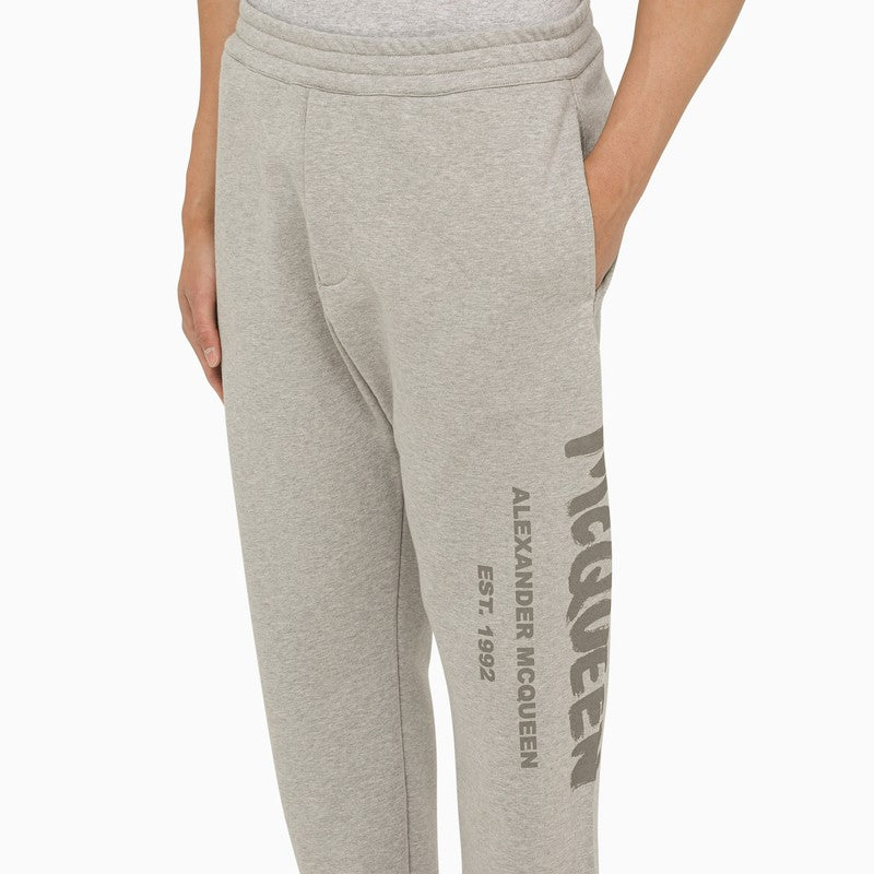 Grey jogging trousers with logo