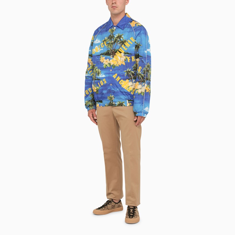 Blue bomber jacket with tropical print