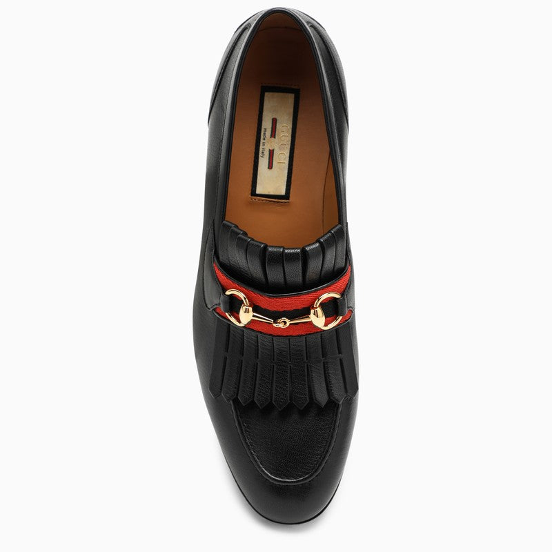 Leather loafers with horsebit and fringes