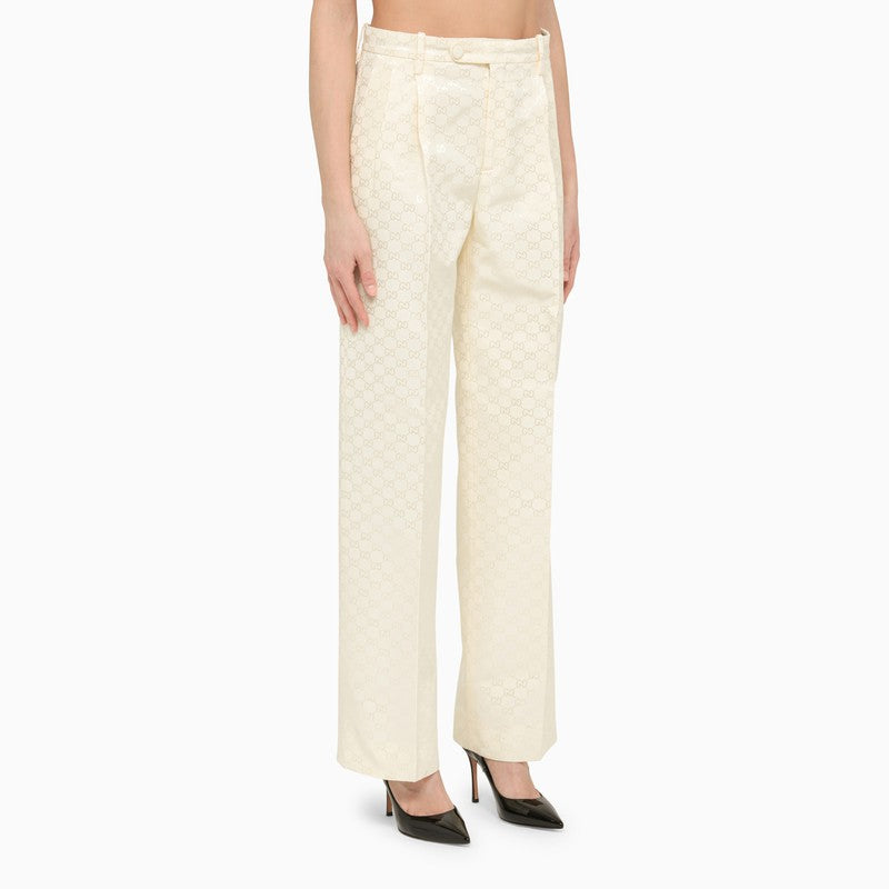 Cream jacquard trousers with logo