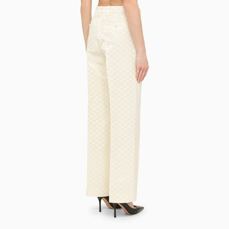 Cream jacquard trousers with logo