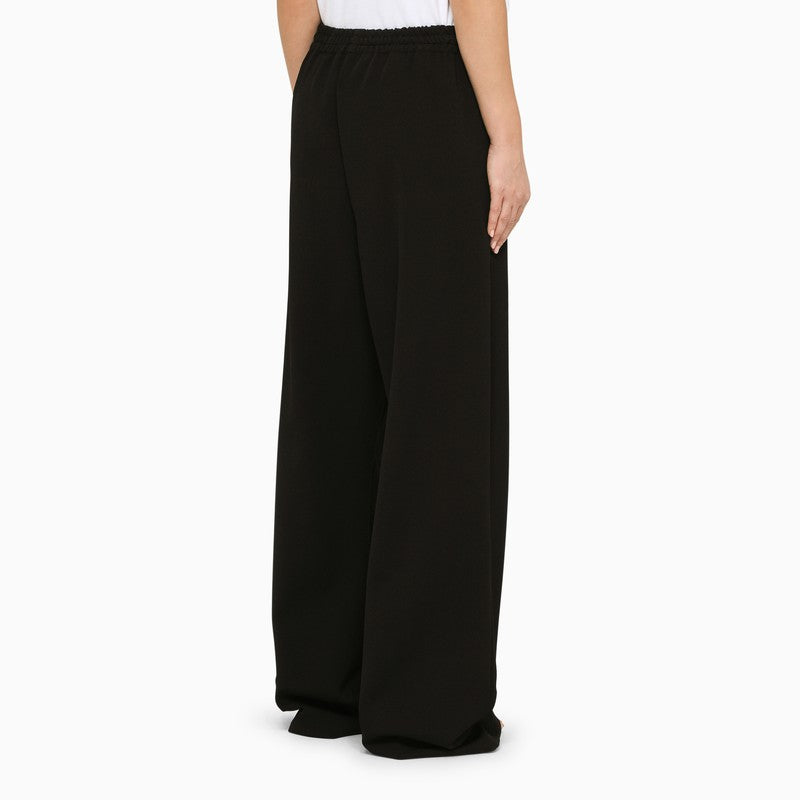 Wide black trousers
