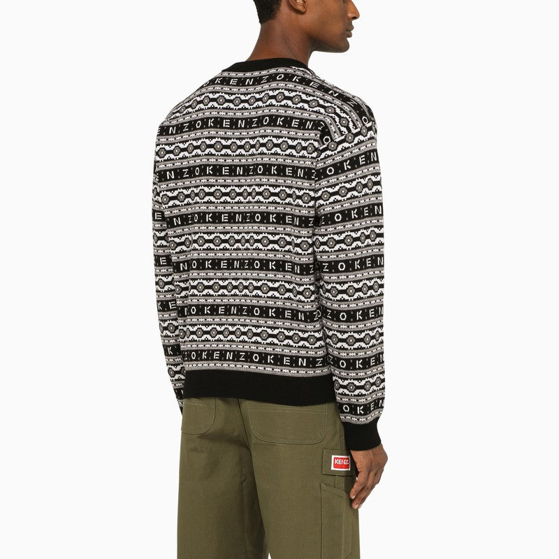 Black and white sweater with all-over logo