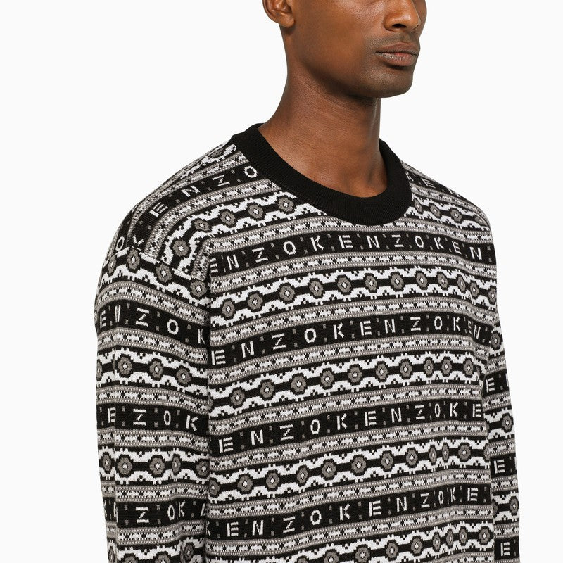 Black and white sweater with all-over logo